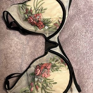 Victoria Secret. Sheer, black trim, embroidered roses. Good condition. Size 38C